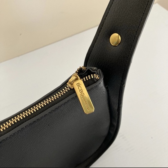 BCBGeneration Black Faux Leather Asymmetrical
Hobo Bag w/ Gold Tone Stud Strap - Picture 8 of 10